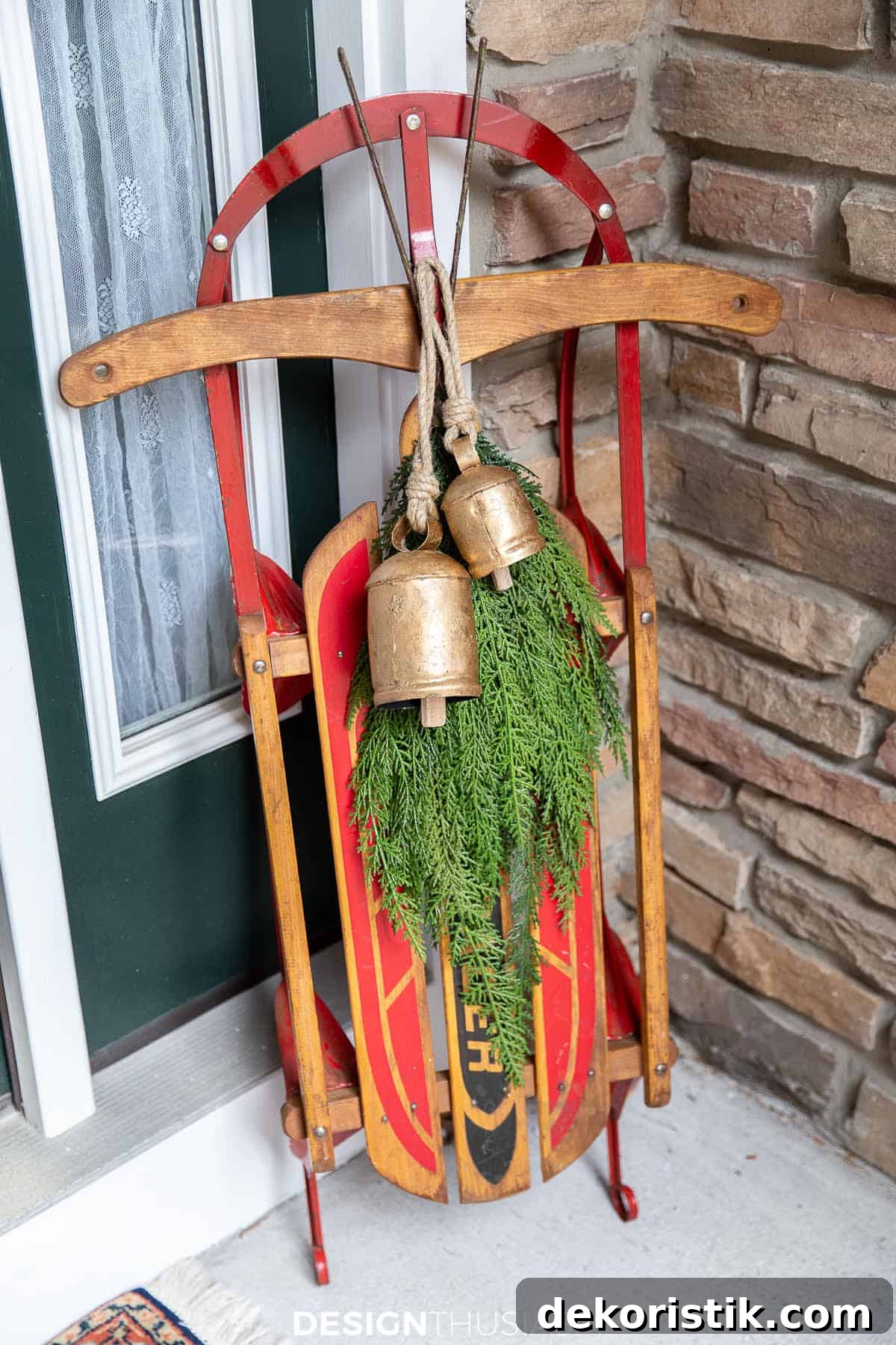 vintage sled leaning against a wall on a porch