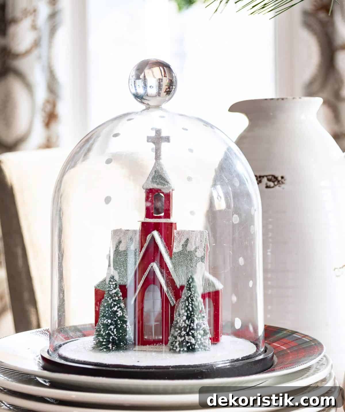tiny red church under a cloche