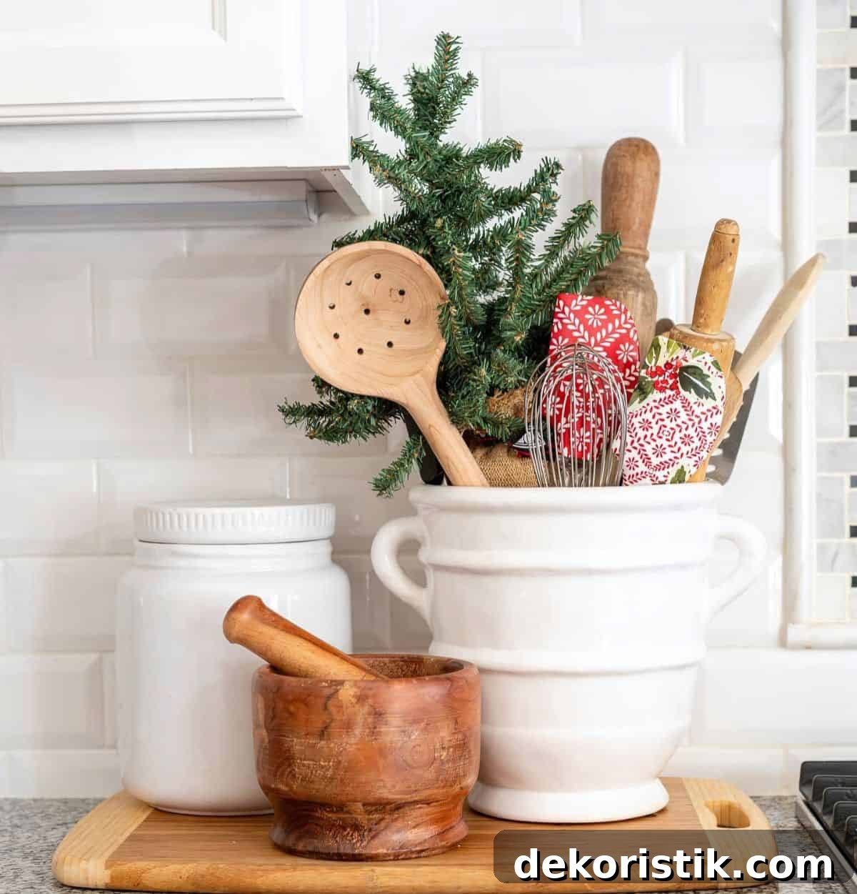 utensil container beside stove with Christmas spatulas
