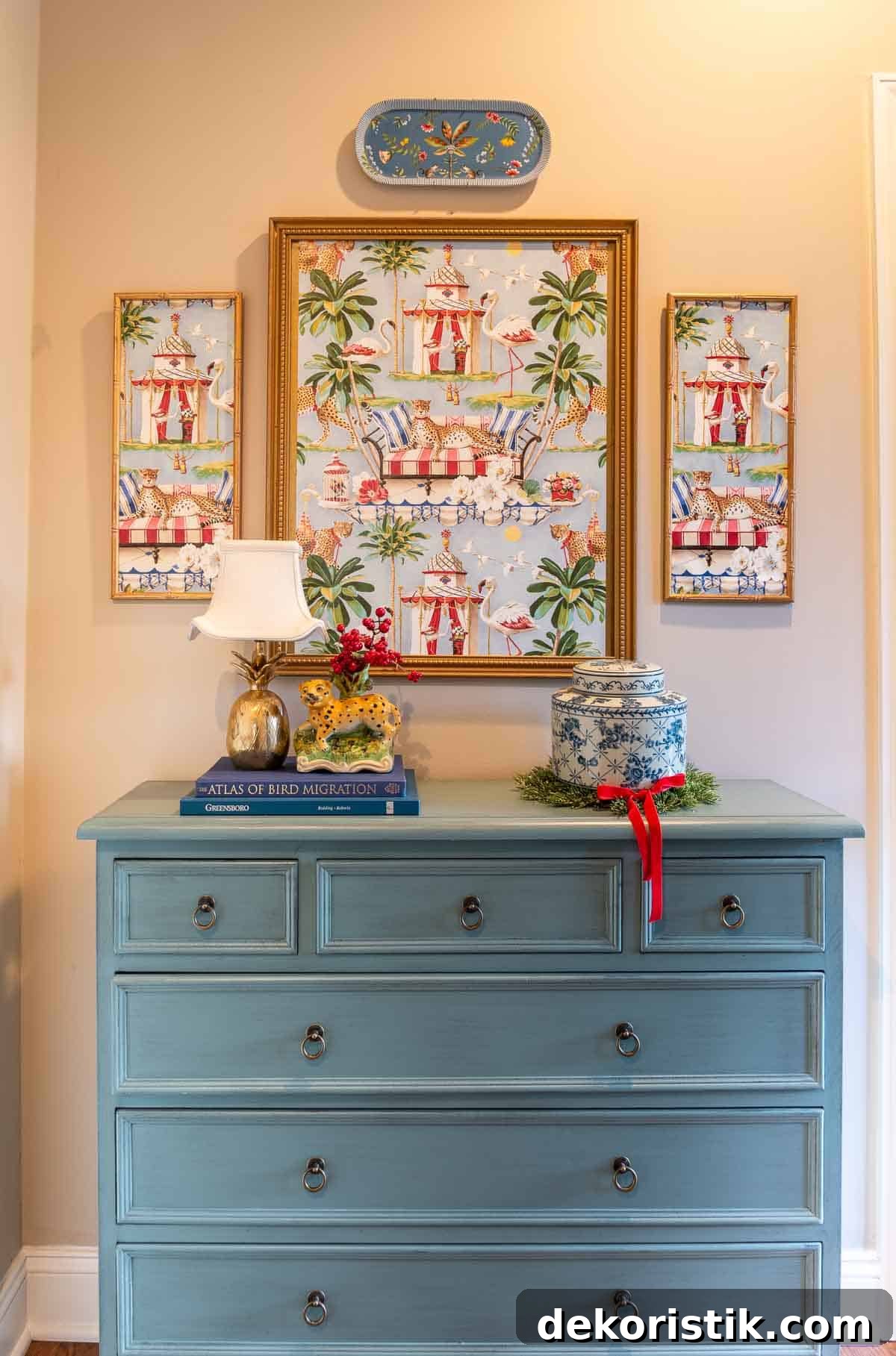 blue chest and chinoiserie artwork and accessories
