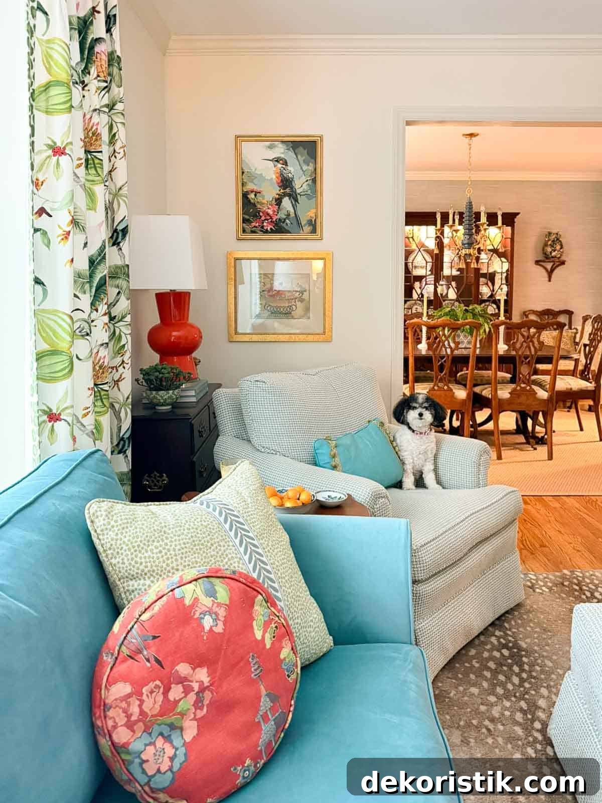 corner of a living room with a blue sofa and other traditional, colorful accessories