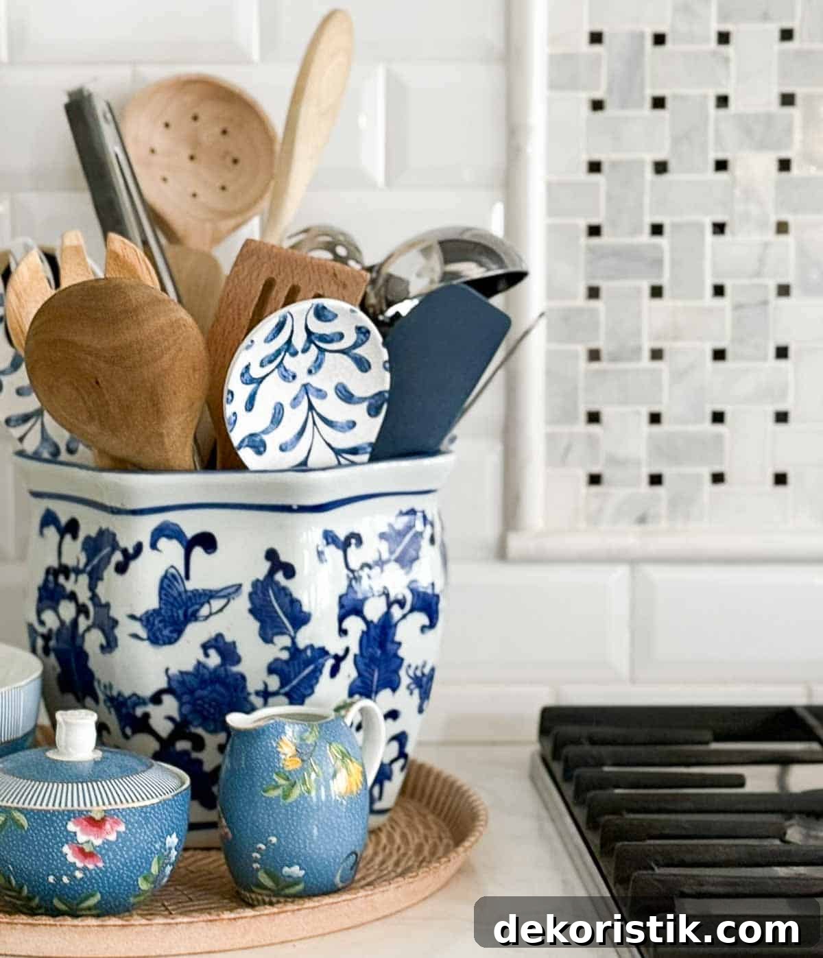 blue, white, and green accessories in an all white kitchen
