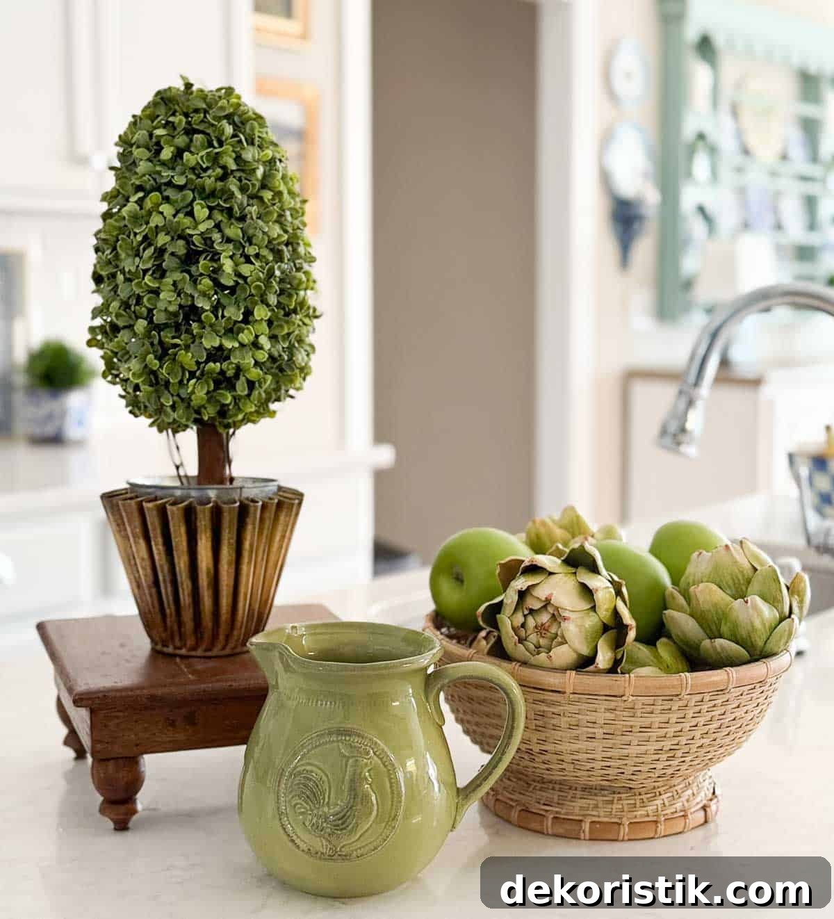 green and wood accessories in an all white kitchen