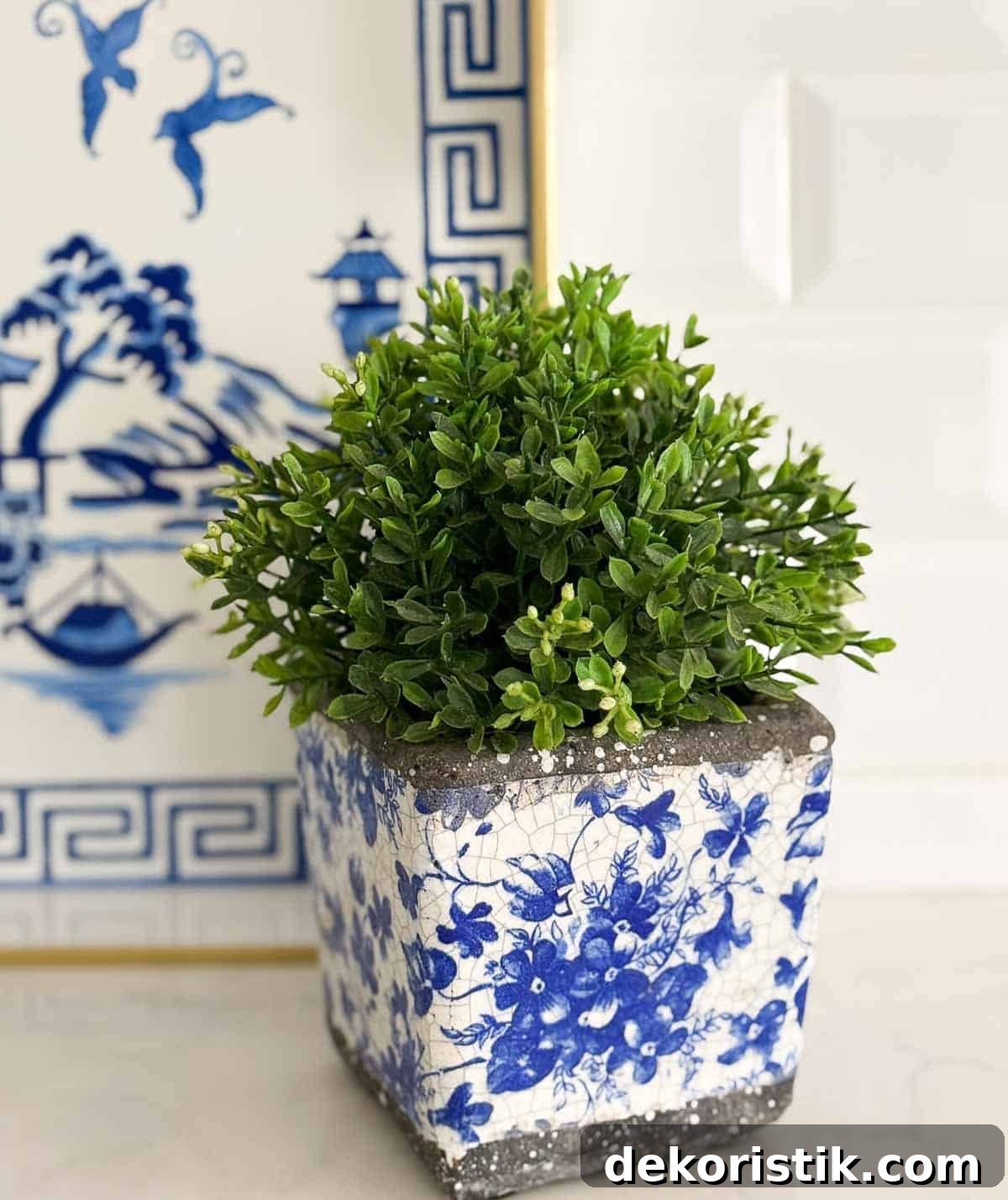 blue, white, and green accessories in an all white kitchen
