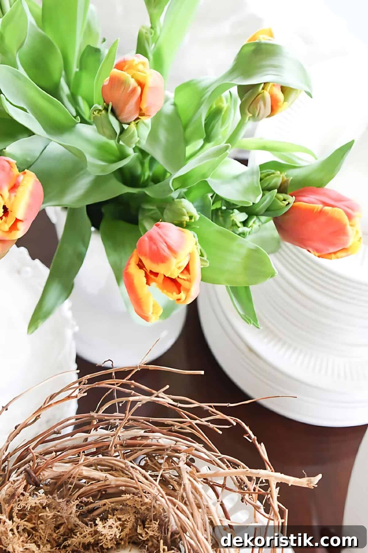 peach colored tulips in a white vase