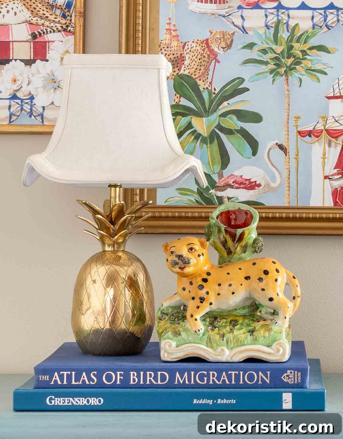 7 Home Decor Ideas to Infuse Personality and Character 11 mini brass pineapple lamp beside a cheetah vase on a blue chest