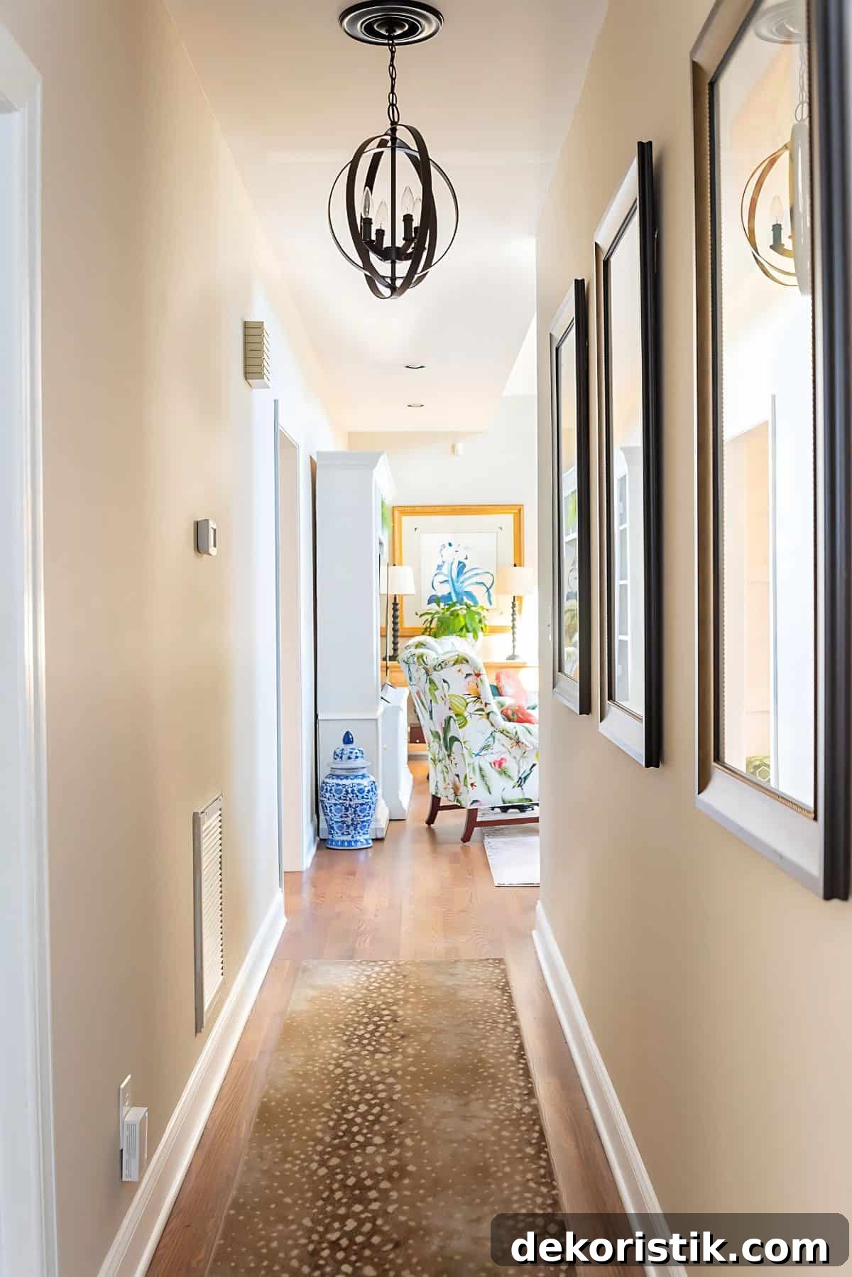 7 Home Decor Ideas to Infuse Personality and Character 6 looking down a hallway with an antelope print rug into a living room with colorful traditional furniture and accessories
