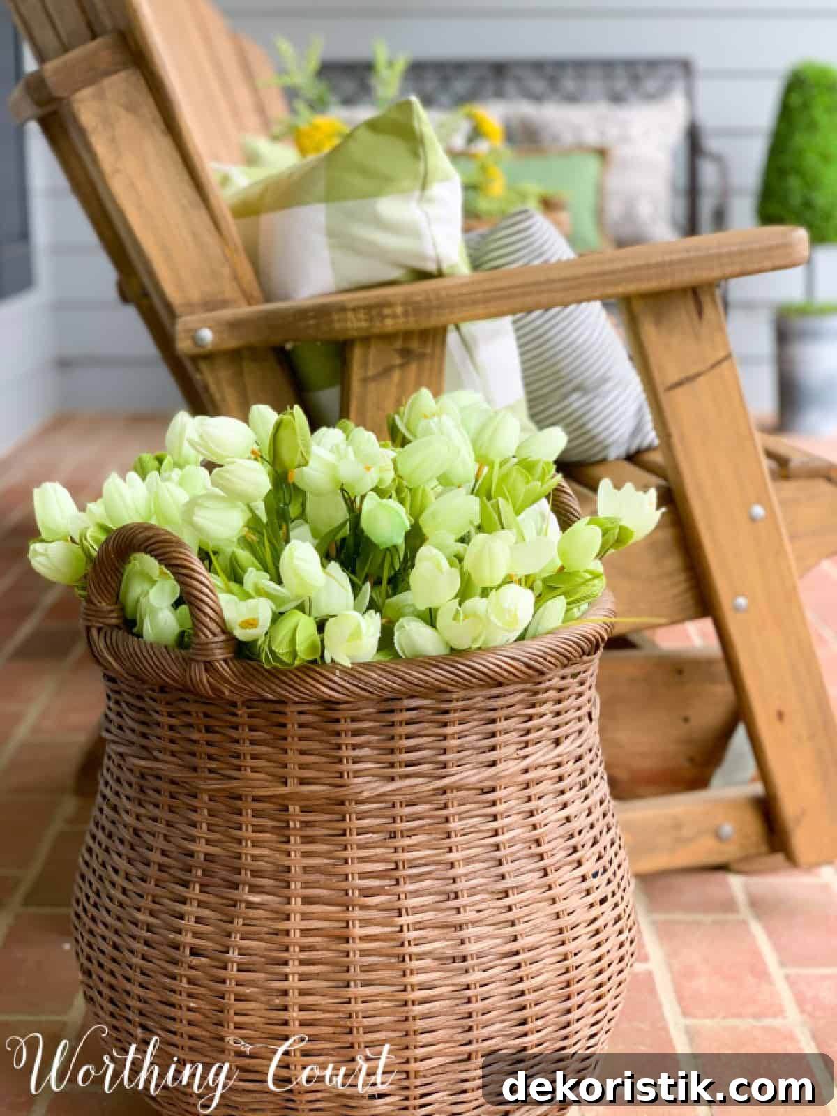 basket filled with faux tulips as part of spring porch decorations