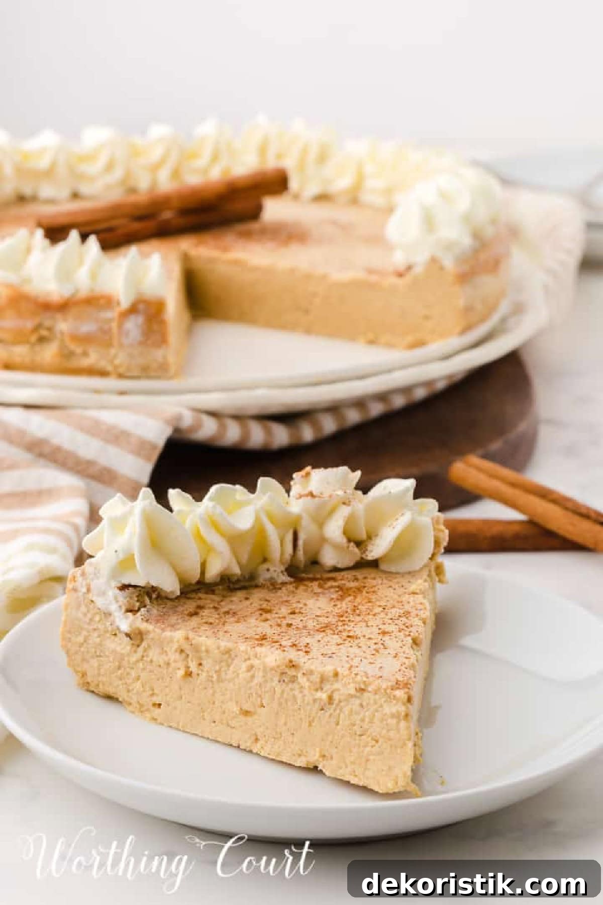 a piece of gingerbread cheesecake on a white dessert plate