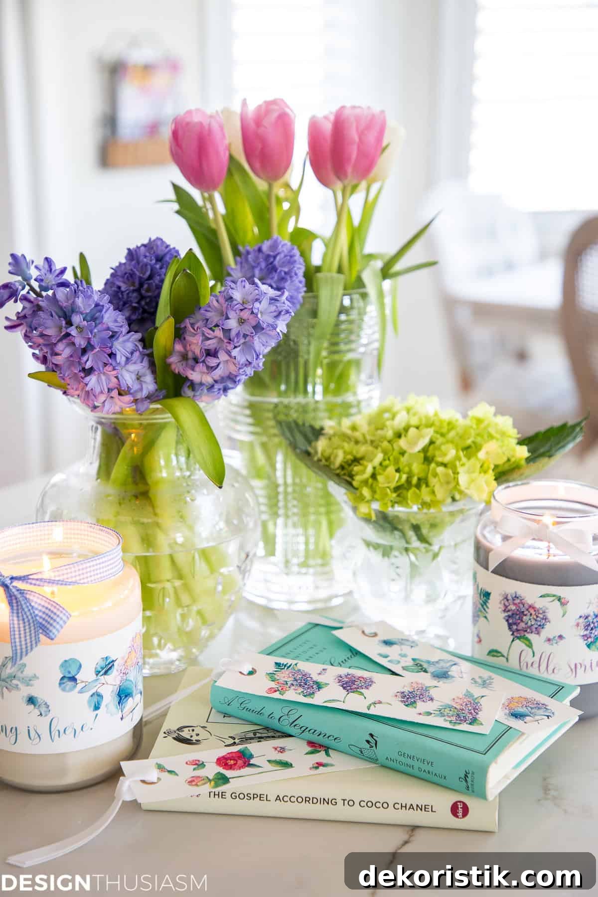 Spring Home Decor Ideas for Bedrooms, Mantels, Colors and More 3 purple hyacinths and pin tulips in vases in a tray on a table