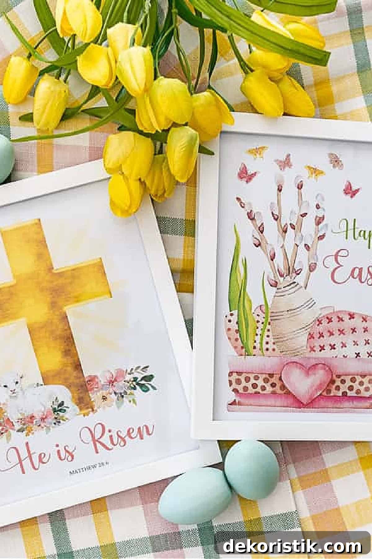 Spring Decorating: Easter Printables and Outdoor Decor 4 Two Easter themed printables in white frames lying on top of a checkered tablecloth beside yellow daffodils