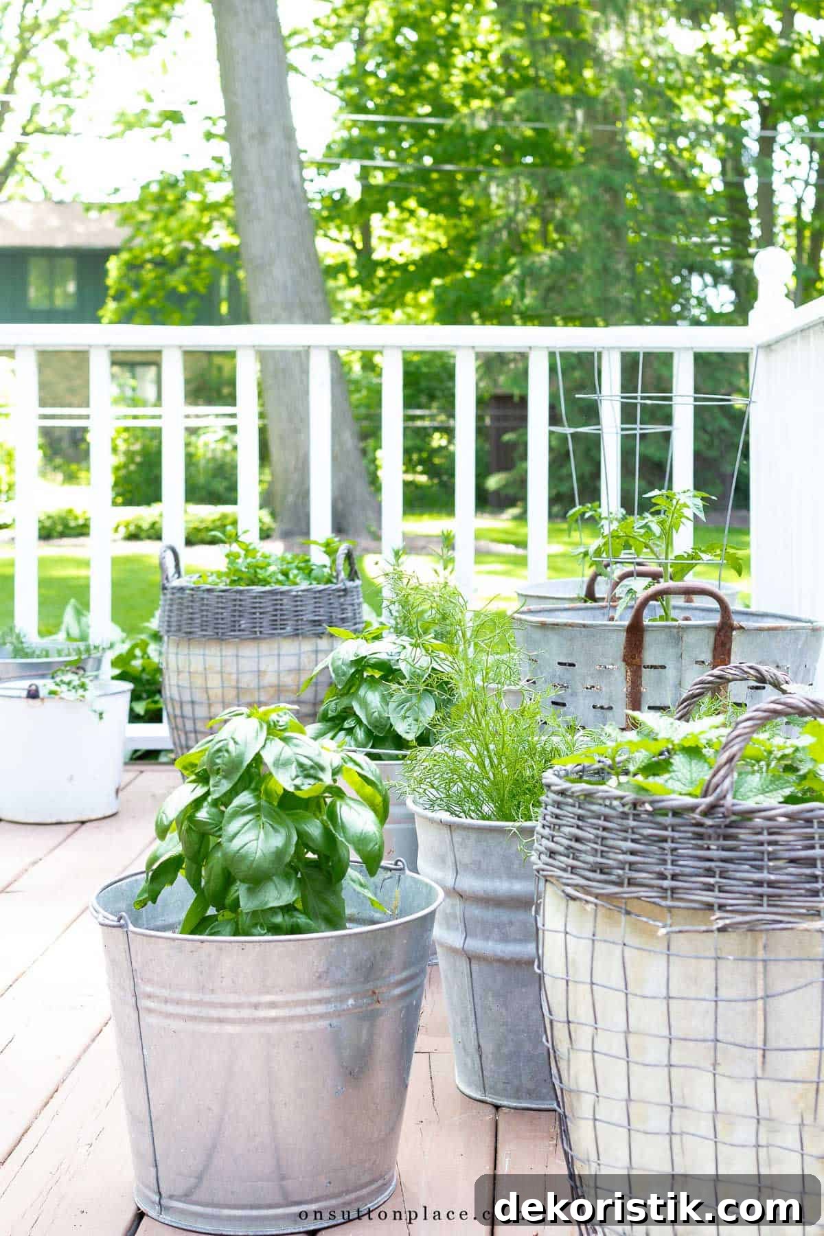 Spring Decorating: Easter Printables and Outdoor Decor 6 several different pots with herbs planted in them on a deck