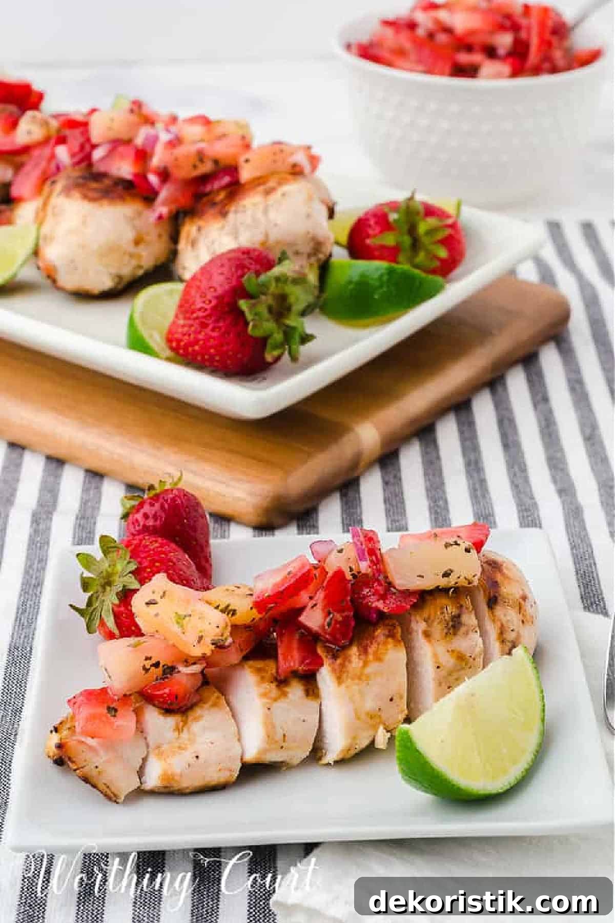 Sliced grilled chick breast topped with strawberry and pineapple salsa