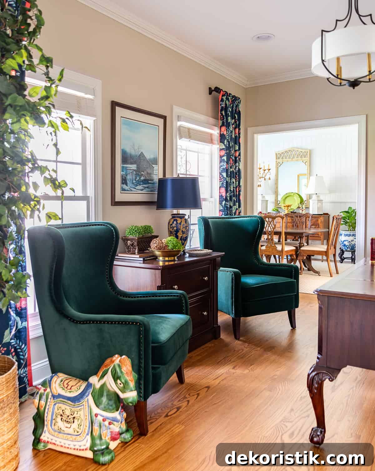 Pair of green velvet armchairs in a home office
