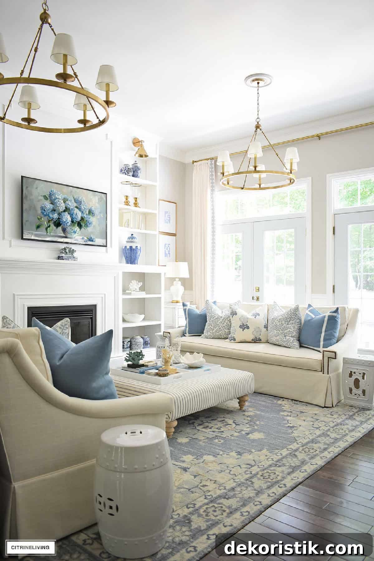 serene living room with white walls and sofas with blue and white summer decor