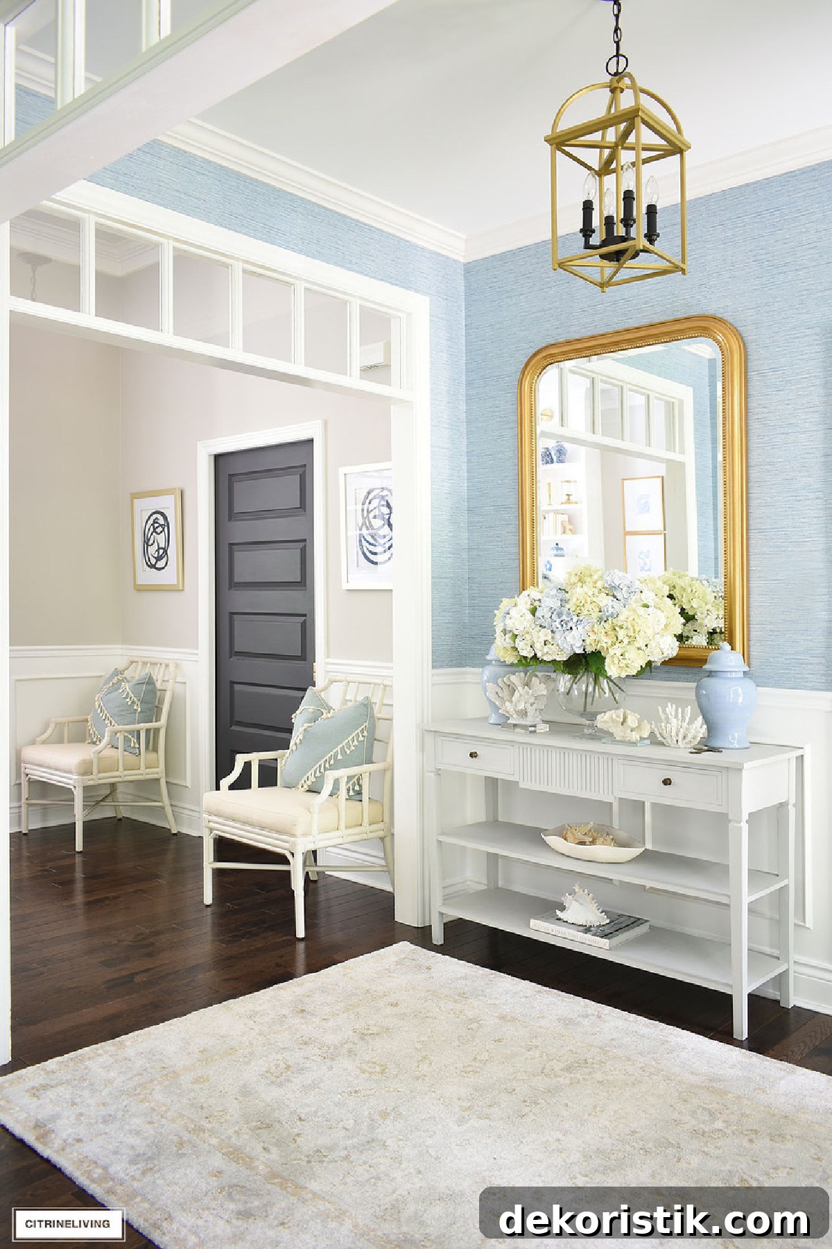 foyer with white furniture, blue walls and blue and white accessories