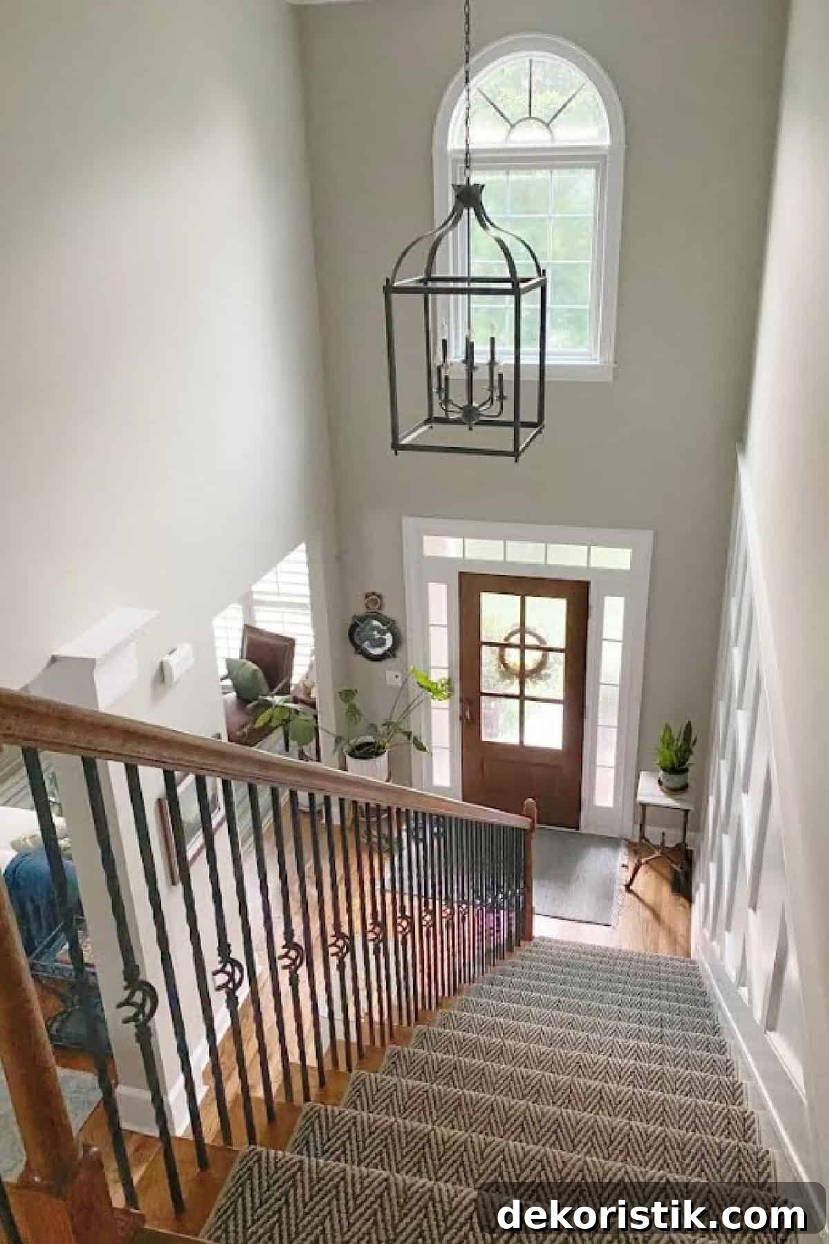looking down a stairway into a foyer