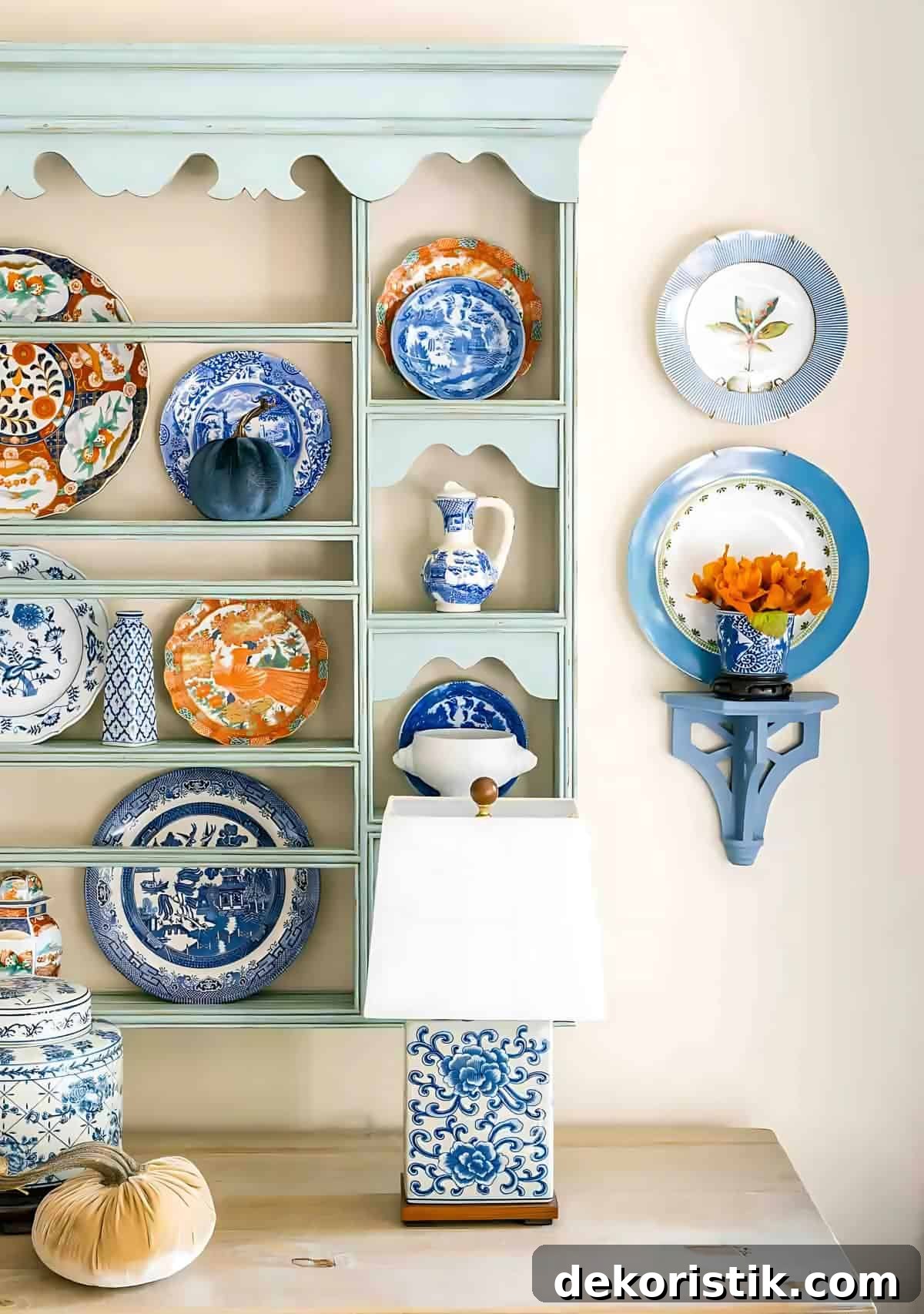 10 Smart Fall Prep Tips to Tackle Now 6 blue plate rack above a white sideboard decorated with blue and orange plates for fall