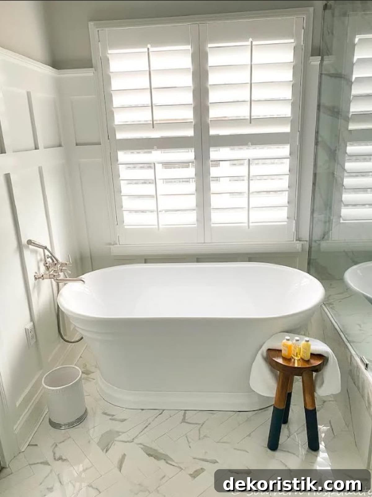 oval free standing bathtub in a remodeled bathroom