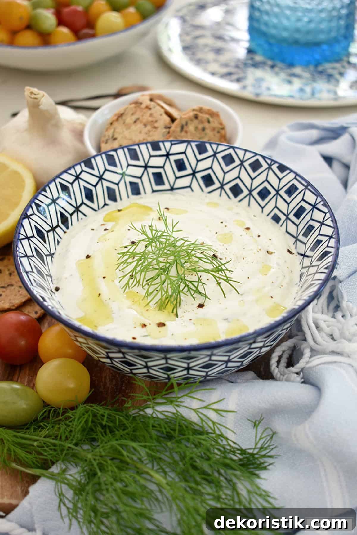 dill greek yogurt dip in a blue and white serving bowl