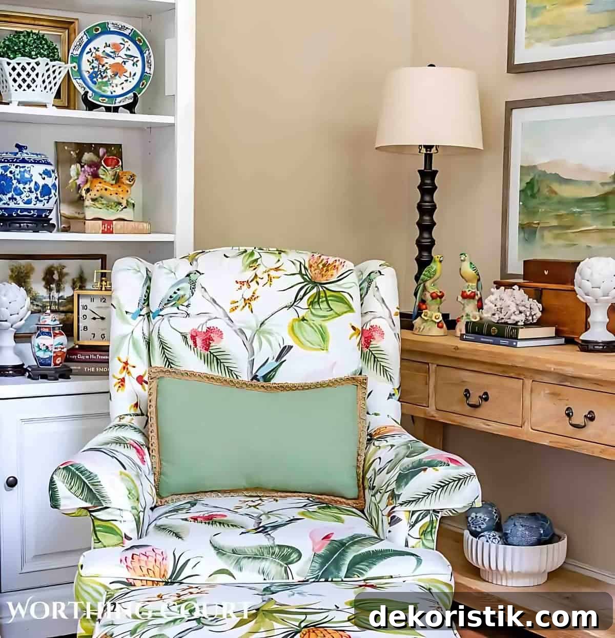 tropical floral print armchair sitting in front of a white entertainment center and pine console table