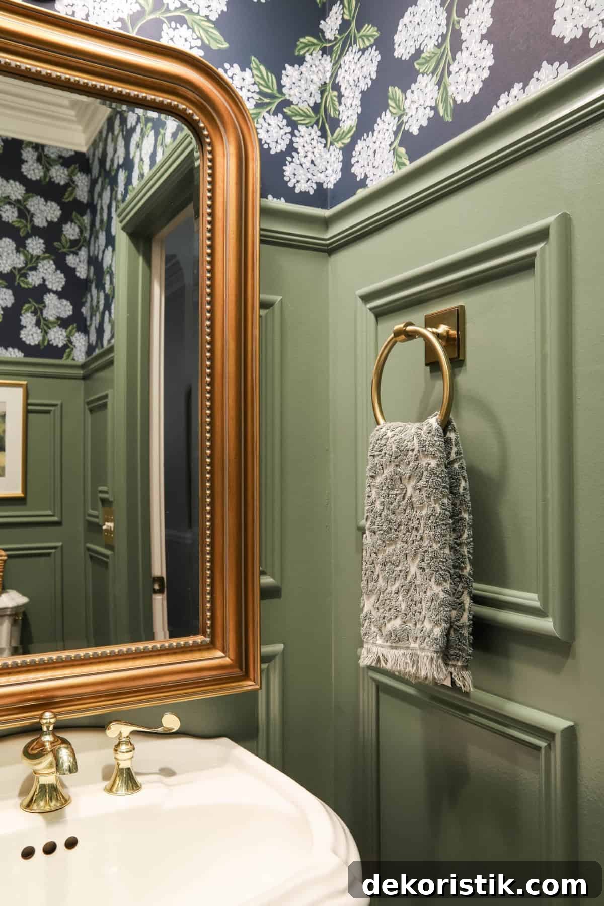 green bathroom wall with applied molding 