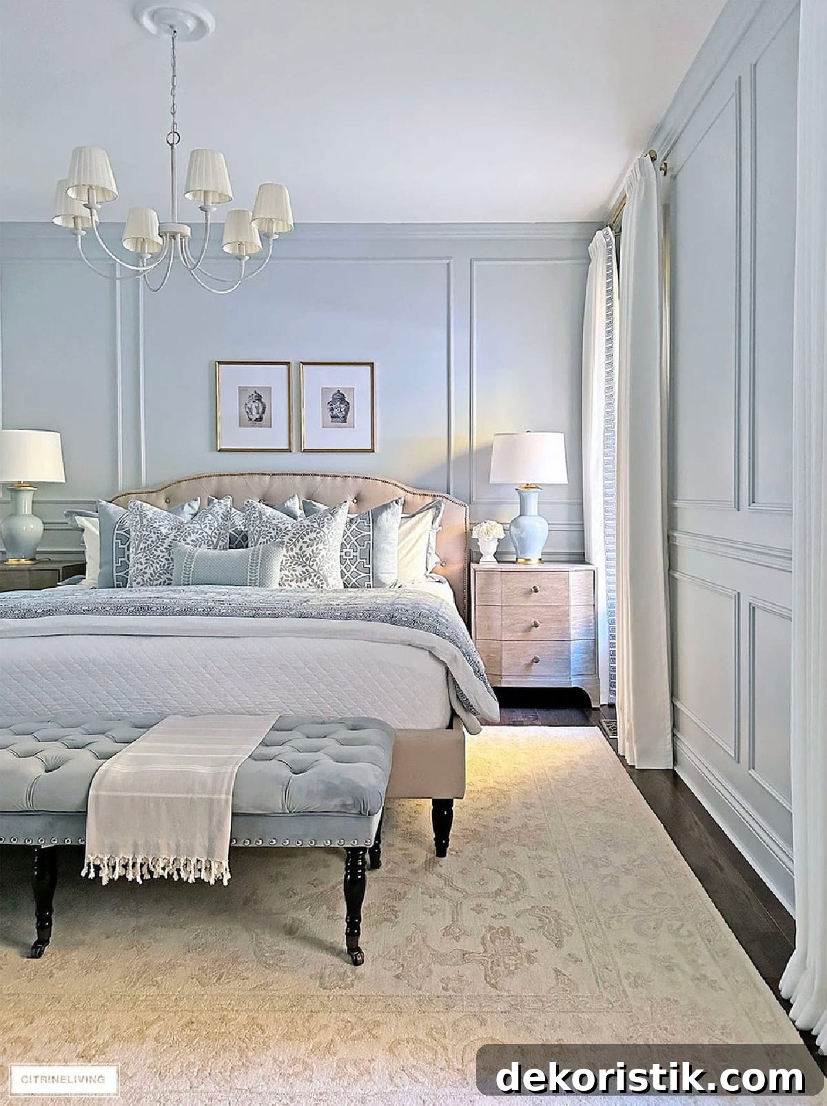 Elegant bedroom with pastel accents, cozy bedding, and classic decor for a relaxing home ambiance.