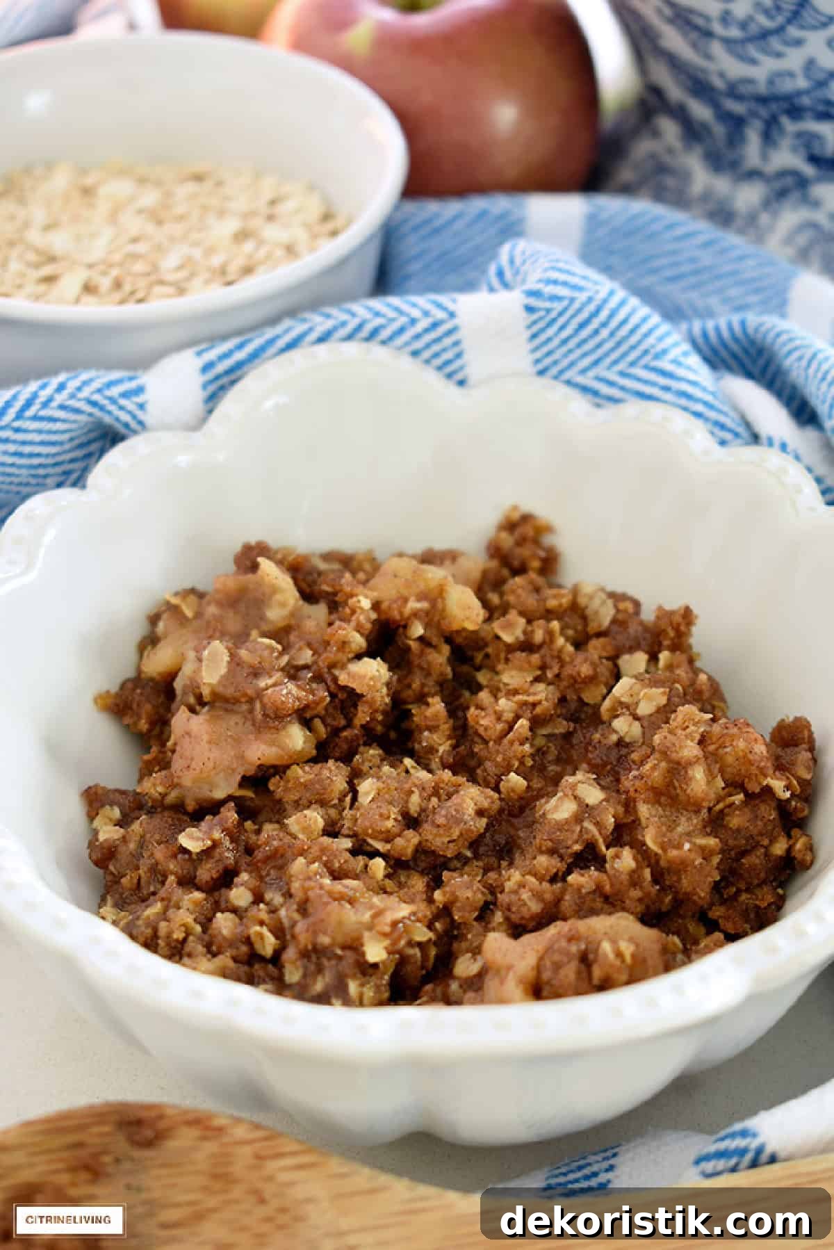 a white bowl filled with apple crisp