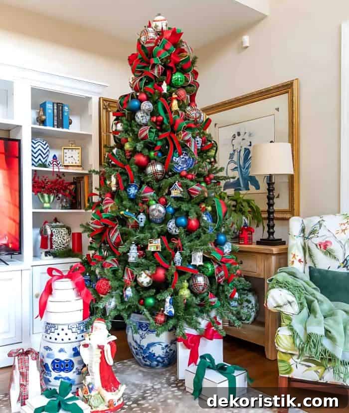 Chinoiserie Christmas tree decorated with red and green ornaments and blue and white Chinoiserie ornaments and tartan plaid ribbon