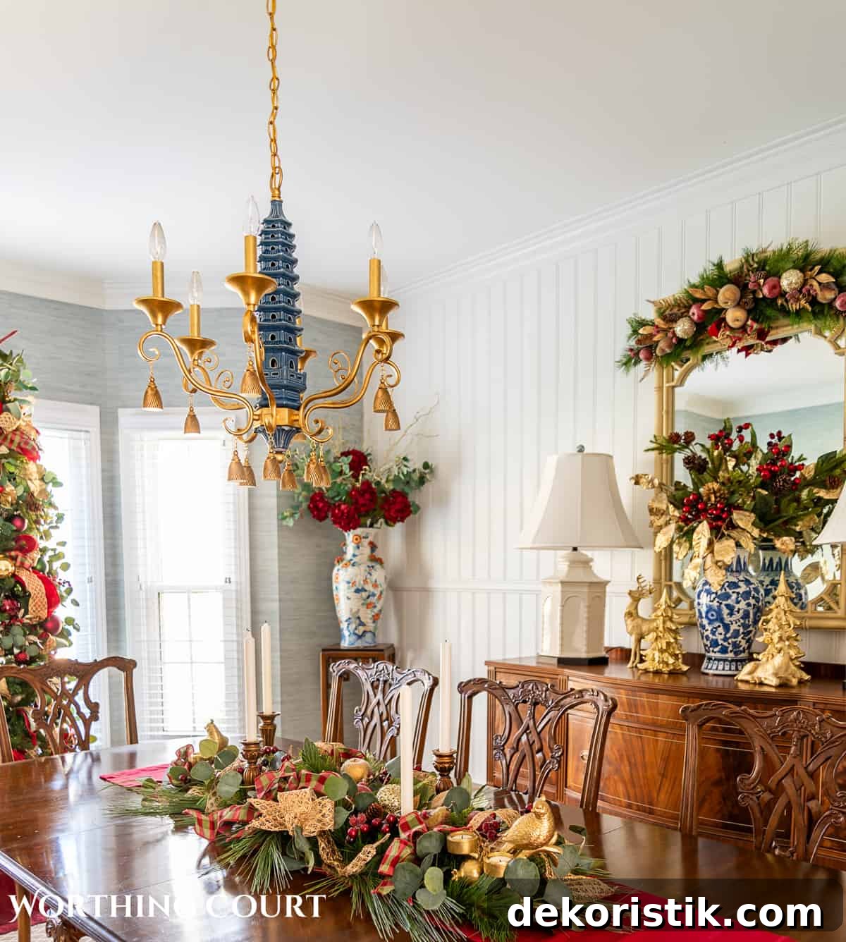 Dining room decorated for Christmas with sage green, burgundy, and gold.