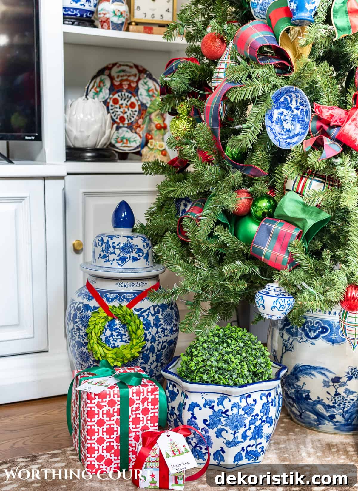 Gifts under a Christmas tree wrapped in colorful paper.