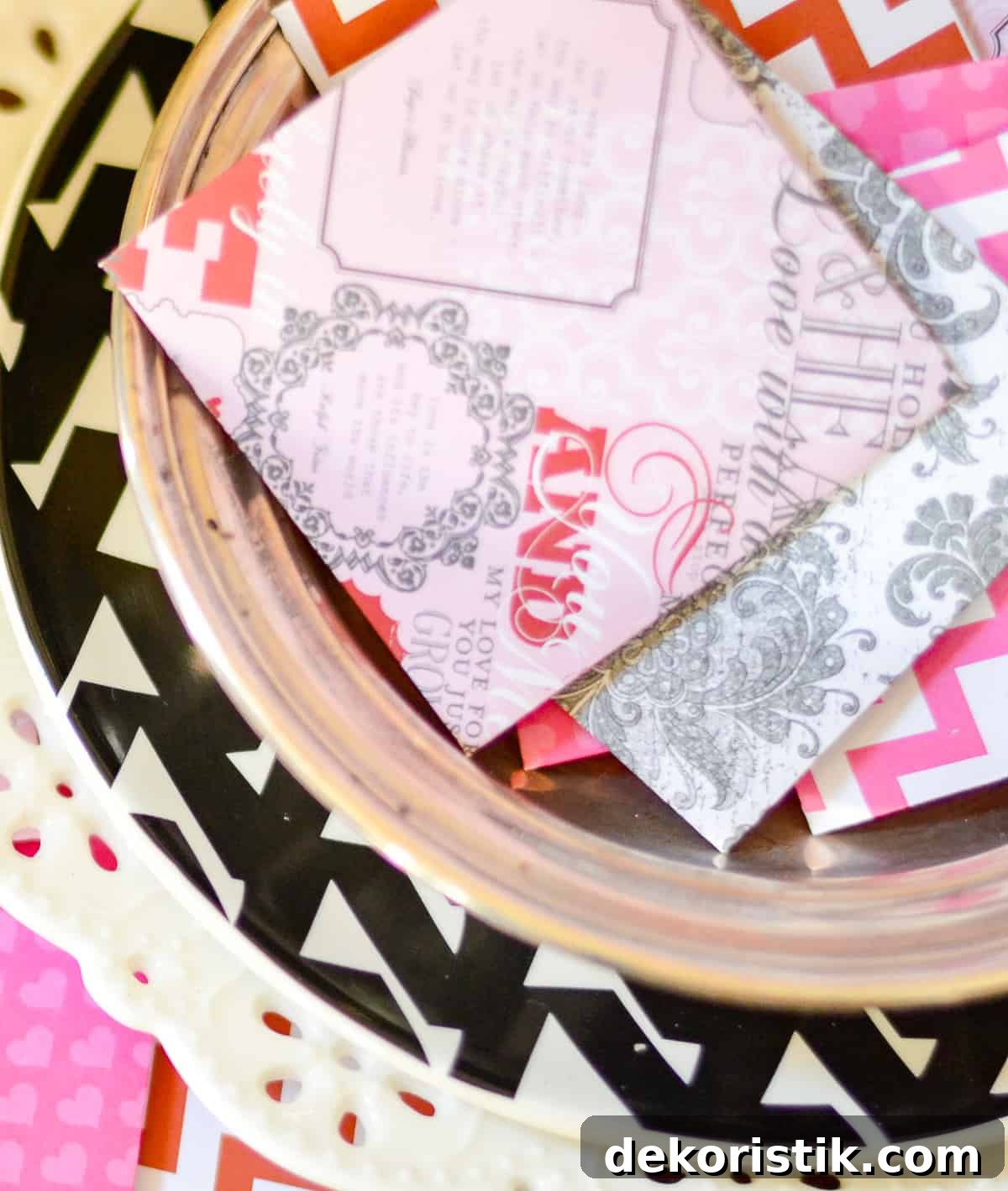 An assortment of mini Valentine's Day cards made with scrapbook paper