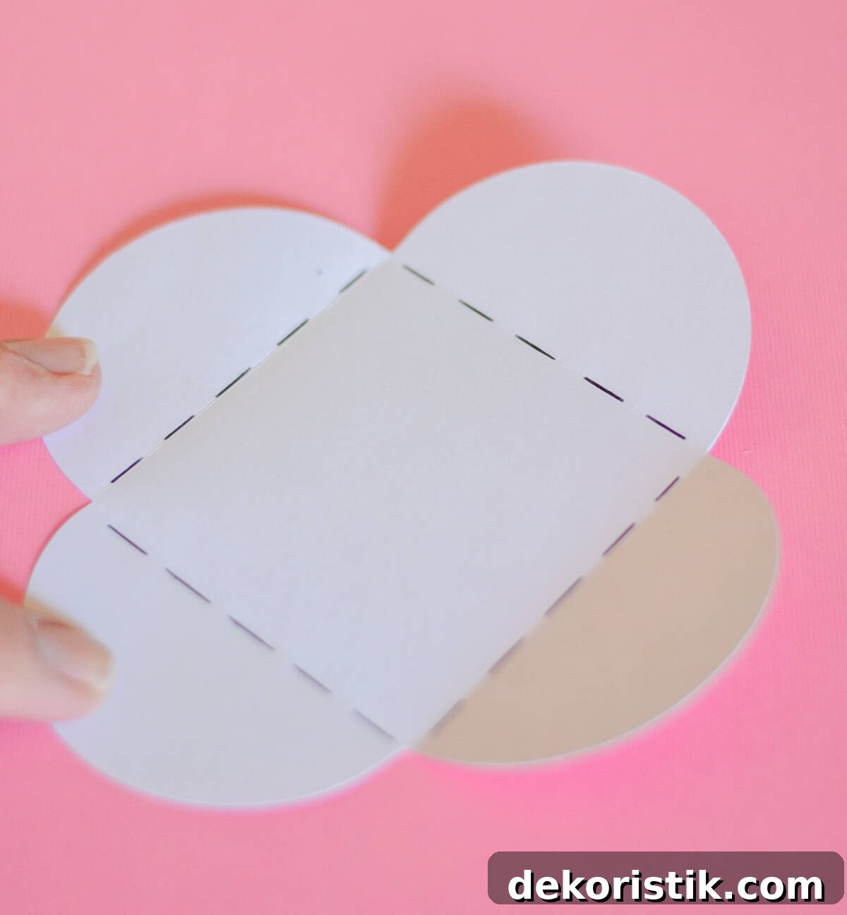 Picture of one of the steps for diy mini Valentine's Day cards made with scrapbook paper.