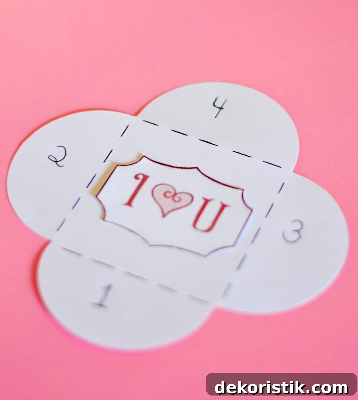 Picture of one of the steps for diy mini Valentine's Day cards made with scrapbook paper.