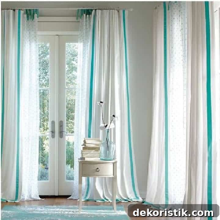 white draperies embellished with blue grosgrain ribbon
