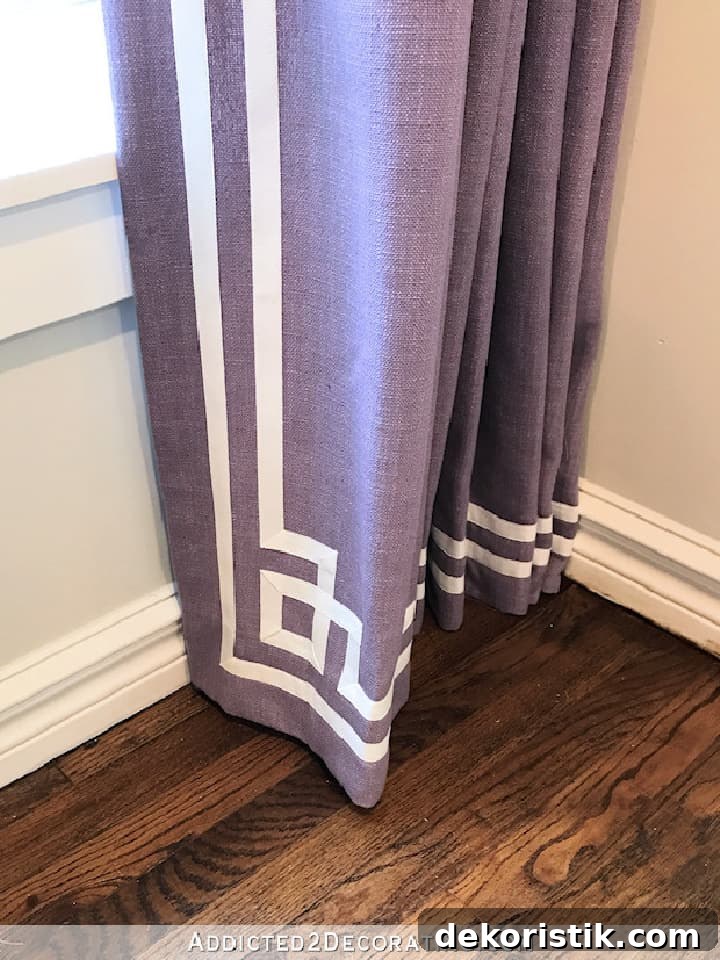 bottom of purple drapery panel with Greek key white ribbon trim