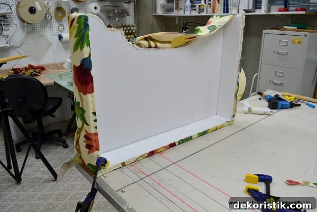 Trimming fabric around cording