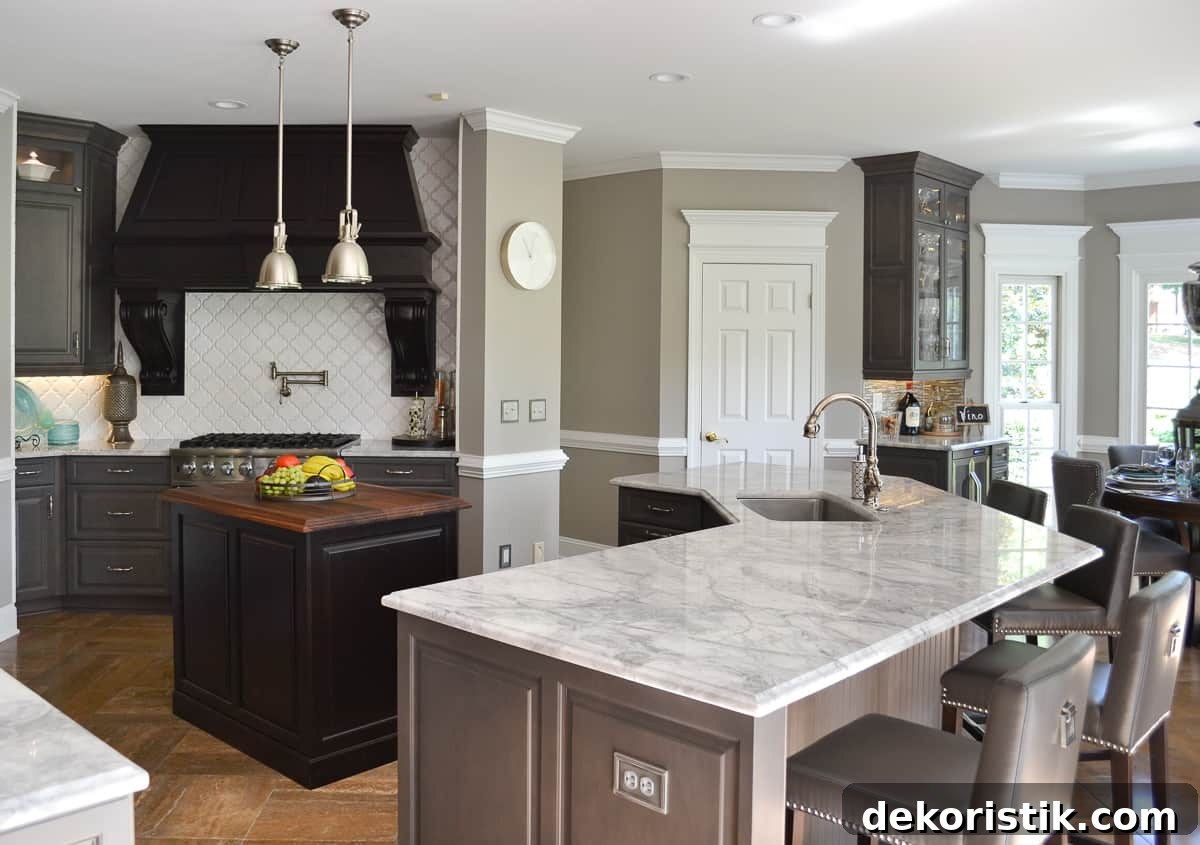 Stunning Kitchen Remodel: Before and After Reveal 9 view of a kitchen with gray custom cabinets and marble-look quartz counters