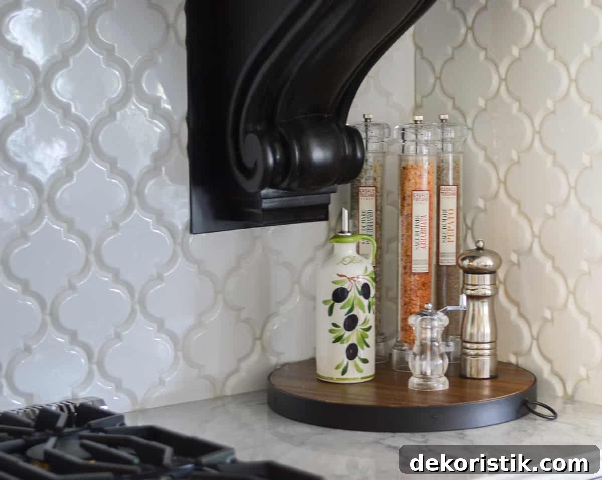 Stunning Kitchen Remodel: Before and After Reveal 5 bottles of flavored oils on a round wood tray on a kitchen counter