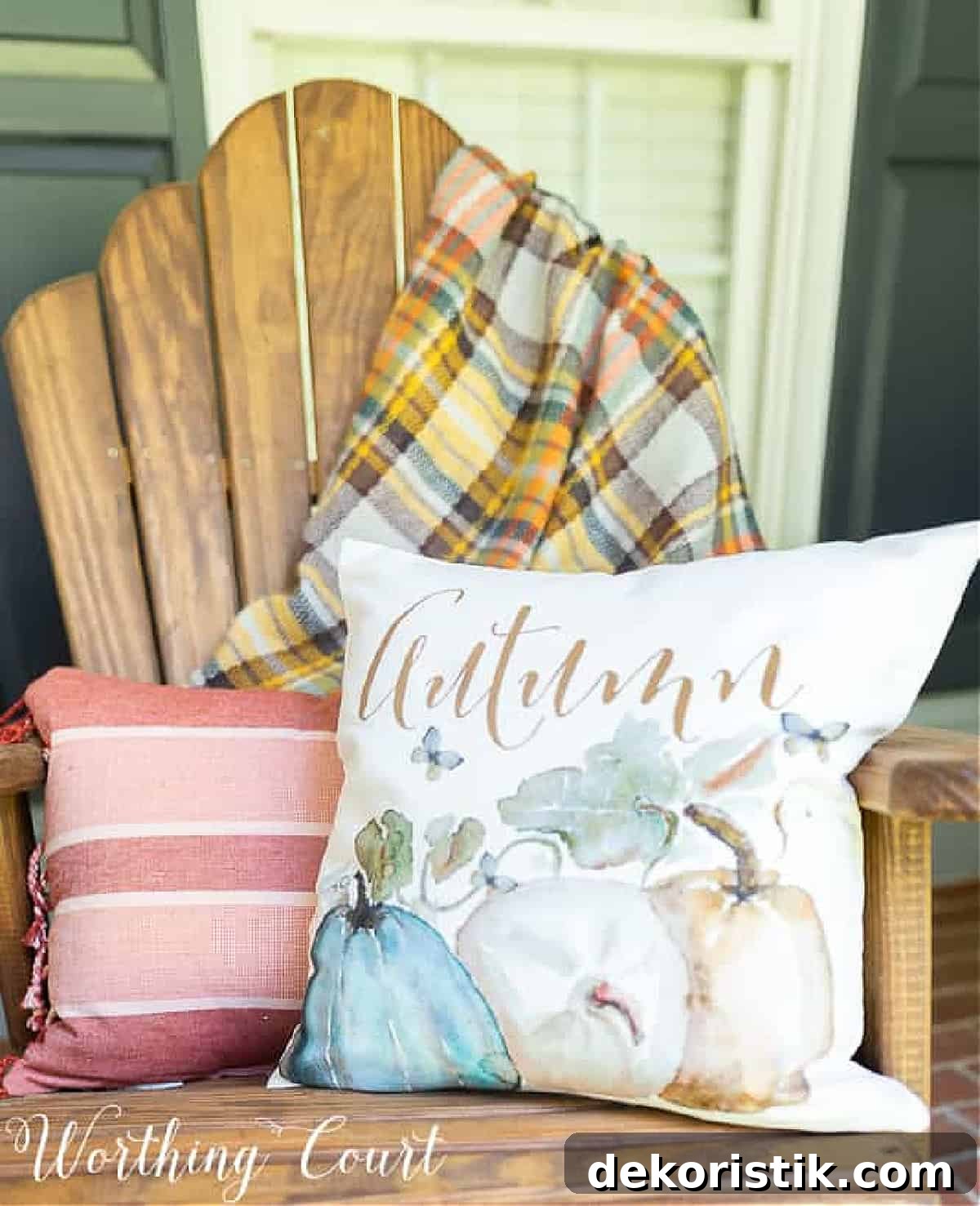 Cozy Plaid Decor Ideas for Fall 12 natural wood chair on a porch with fall throw pillows and a plaid fall throw blanket over the back