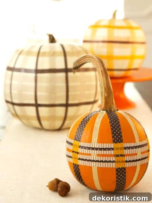 Cozy Plaid Decor Ideas for Fall 7 Create plaid pumpkins with washi tape.