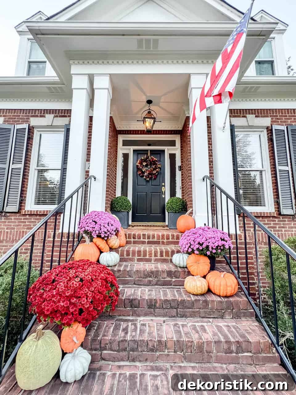 Realistic faux pumpkins in a fall vignette