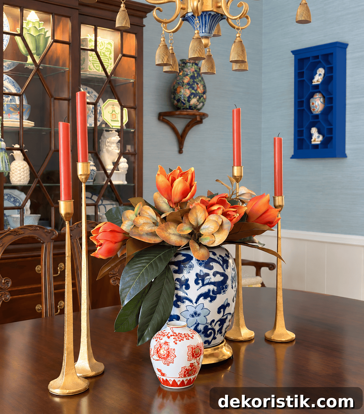 Brass candlesticks and warm accents on a dining surface