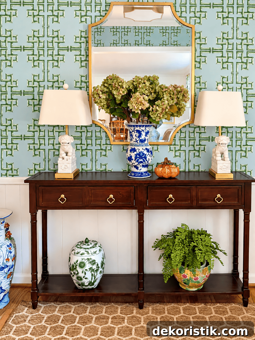 Mirror reflecting dried hydrangea stems in a foyer vignette