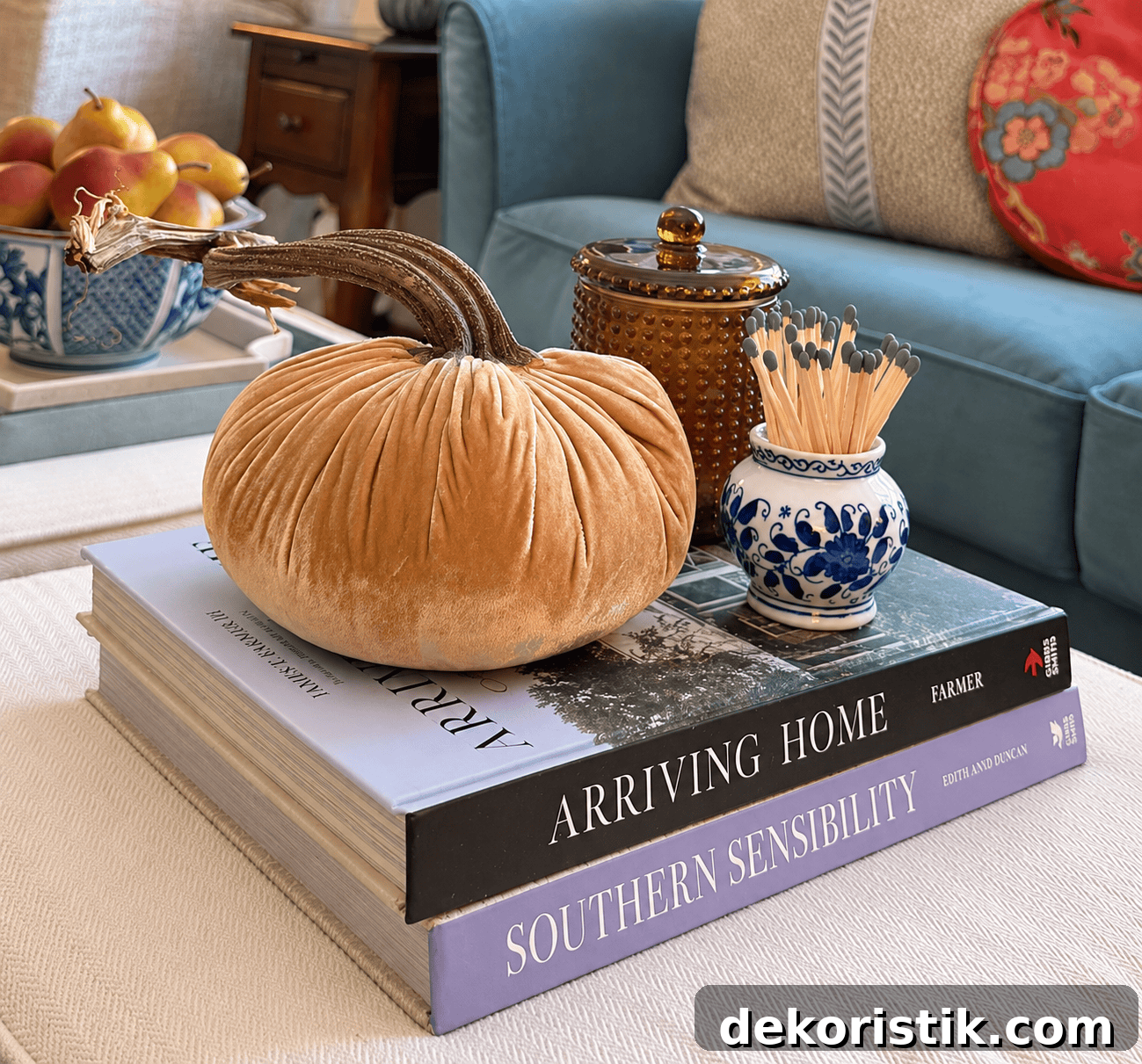 Velvet pumpkin centerpiece on a coffee table