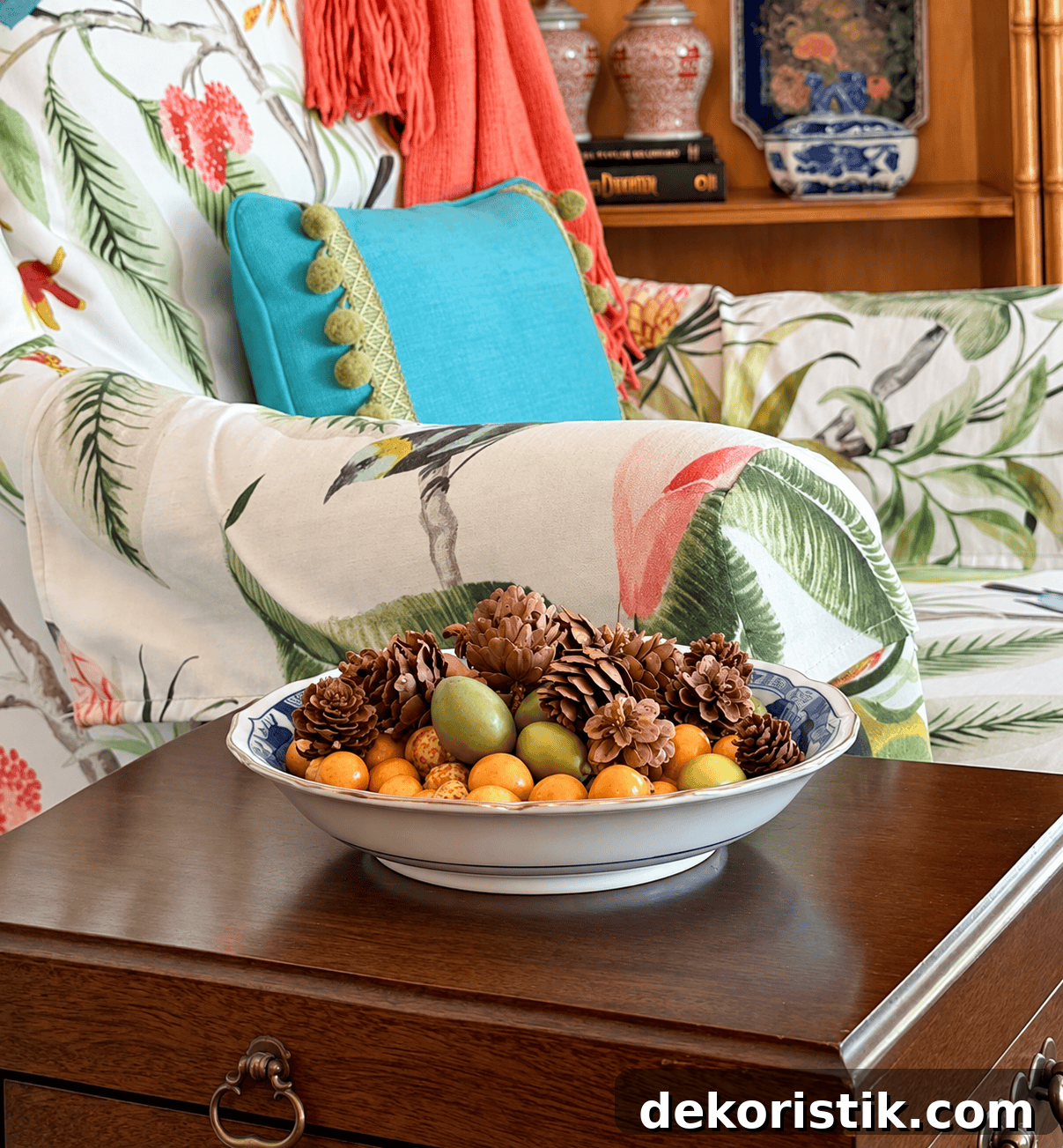 Bowl filled with faux mini pears and velvet pumpkin on a coffee table
